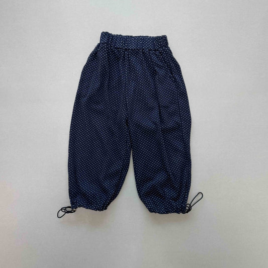 Navy blue pants with white polka dots 