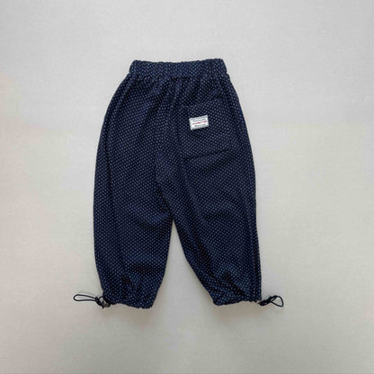 Navy blue pants with white polka dots 